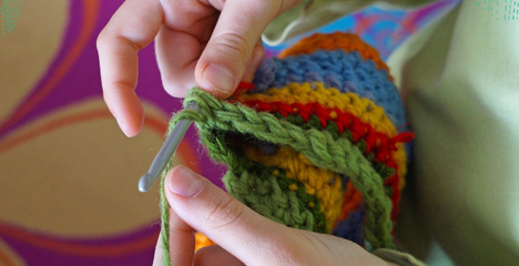 Two hands crocheting 
