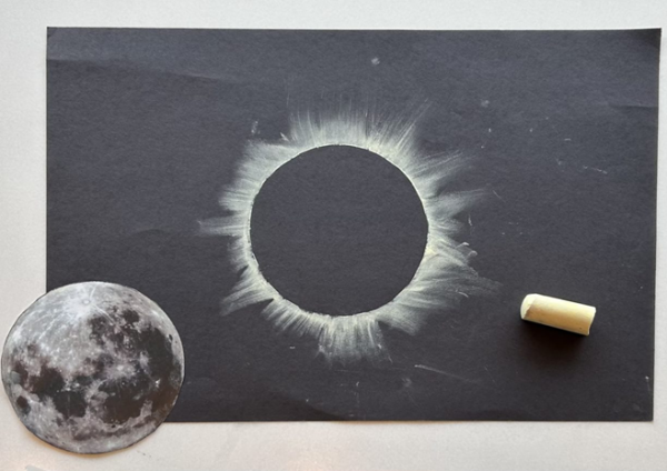 Chalk rendering of an eclipse on black construction paper.