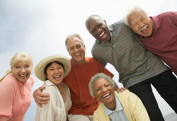Group of elderly people smiling for a picture 