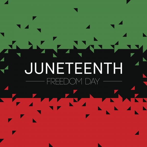 Green black and red sign that has wording JUNETEENTH FREEDOM DAY 