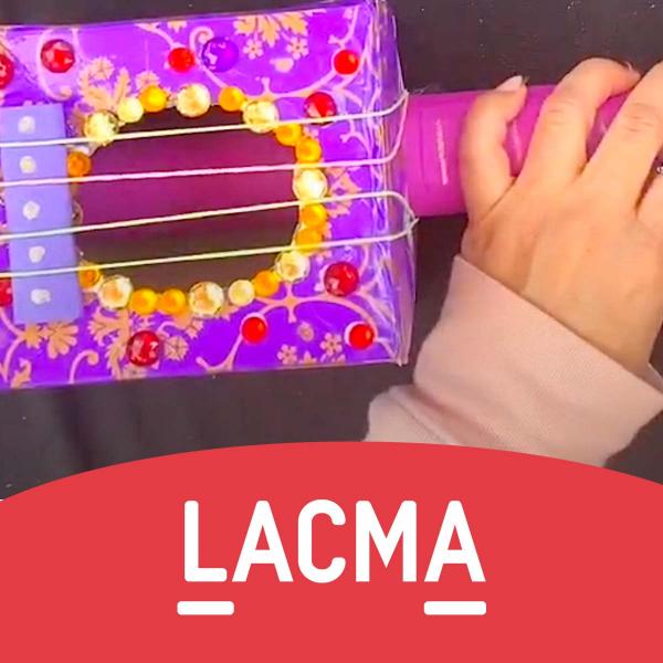 LACMA lettering on bottom and a small hand holding a purple play guitar 