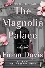 Book cover for The Magnolia Palace by Fiona Davis. Cover shows a photo of a young woman in old fashioned clothing climbing the steps of an impressive white stone building toward a large black door. In the foreground are magnolia blossoms.