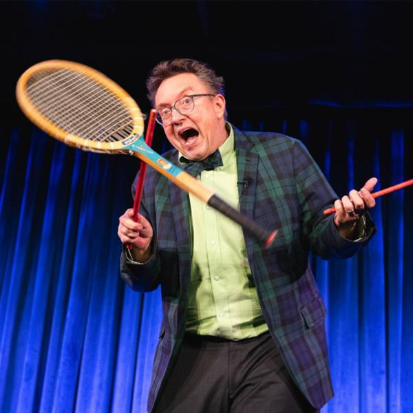 Michael Rayner juggling tennis racket 