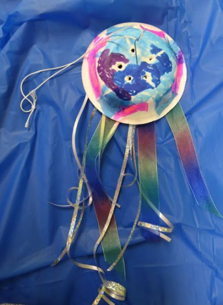Jellyfish craft made out of paper plate and ribbon