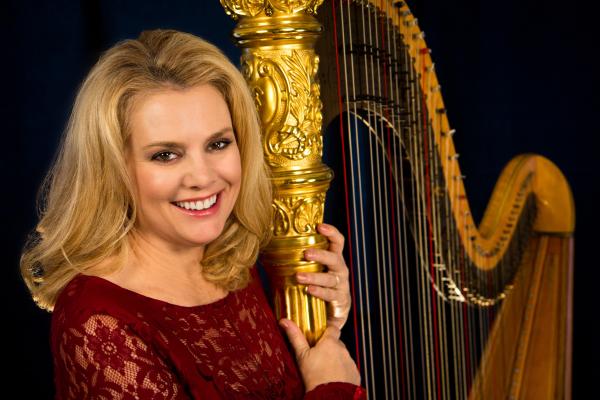 Picture of harpist Peggy Skomal with her harp.