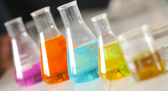 Beakers filled with different colored liquid.