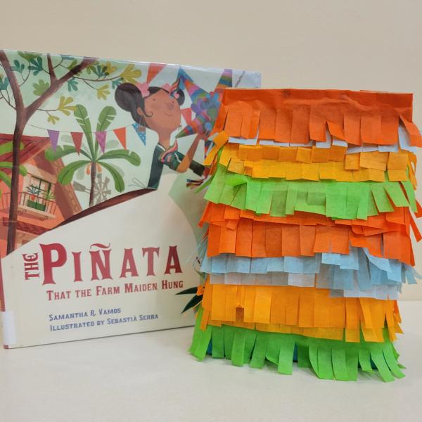 paper bag piñata and book about piñatas