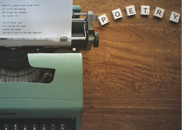 old fashion typewriter with poetry spelled out