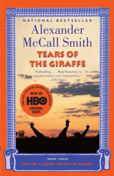 Book cover of the novel Tears of the Giraffe which has giraffes against a sunset background