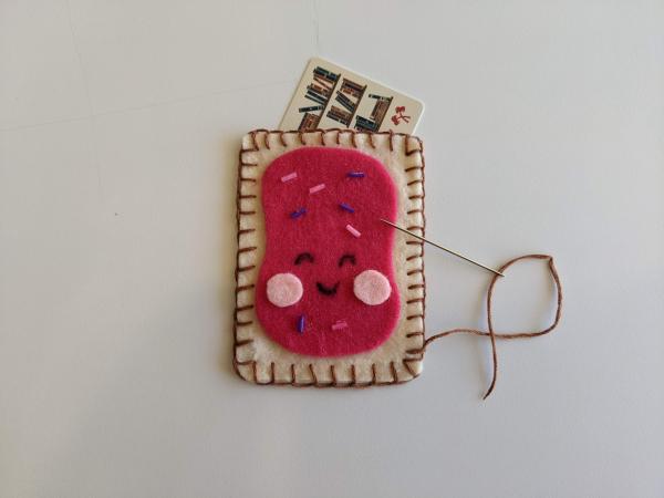 Felt and embroidery gift card holder shaped like a toaster pastry.