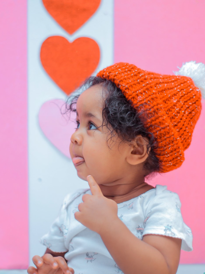 Valentine's Day with Baby in front of Heart Backdrop