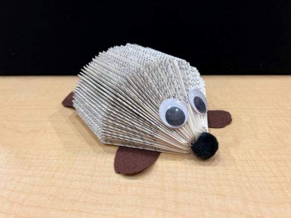 Hedgehog art activity created with book pages and googly eyes 