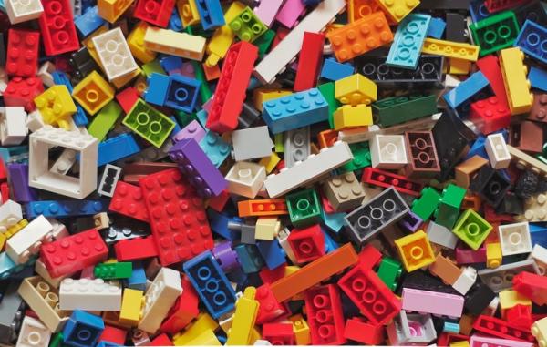 Variety of many colorful LEGO building blocks scattered around