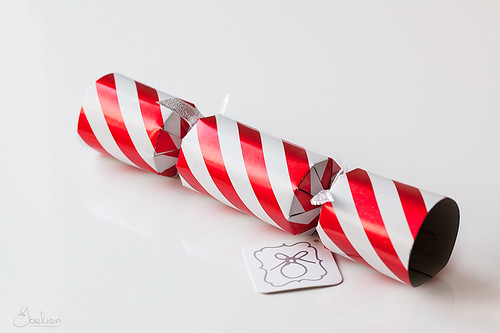 new years cracker (rolled tube) wrapped in red & white striped gift wrap