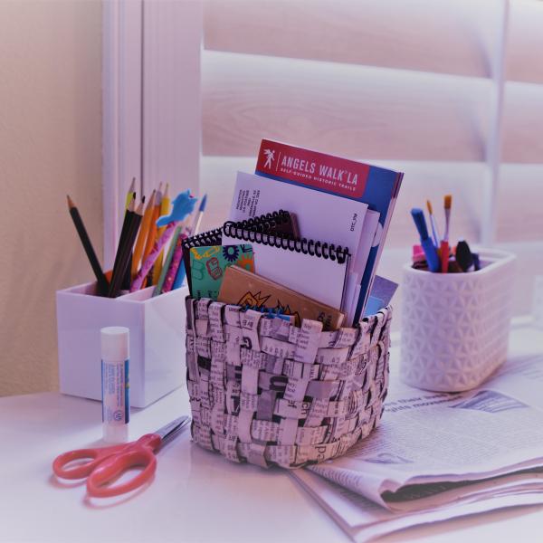 two paper baskets and office supplies