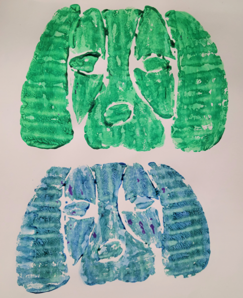 Print of a dog's head in blue and green