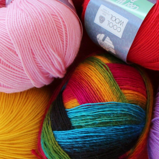 Photo of different colored skeins of yarn.